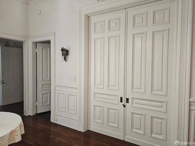 an empty room with wooden floor