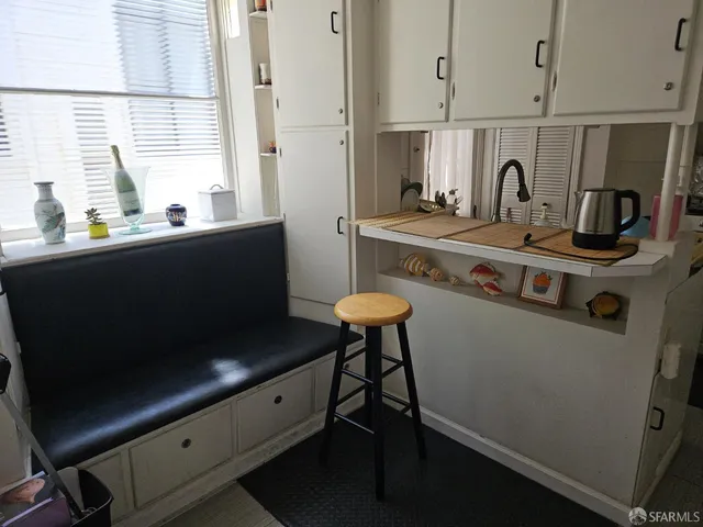 a kitchen with stainless steel appliances a stove a sink and a refrigerator