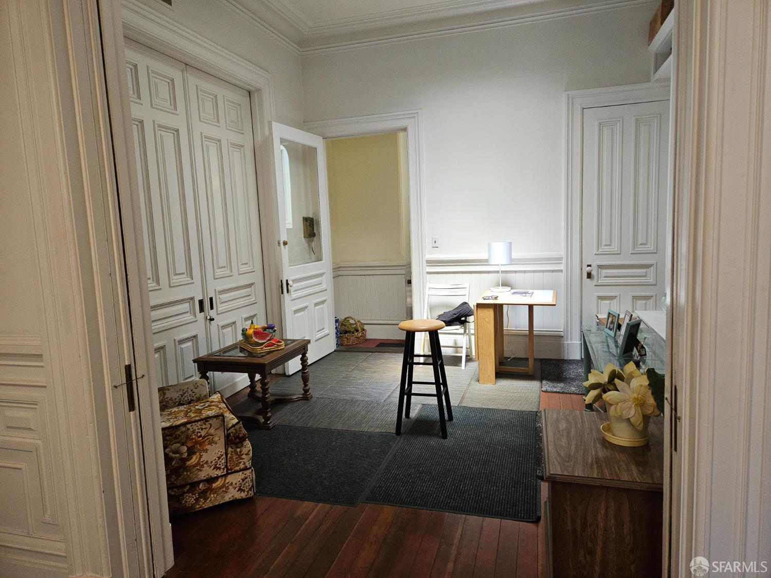841-845 Fulton Street San Francisco, CA 94117 - Photo 28 of 32 a living room with furniture and a wooden floor
