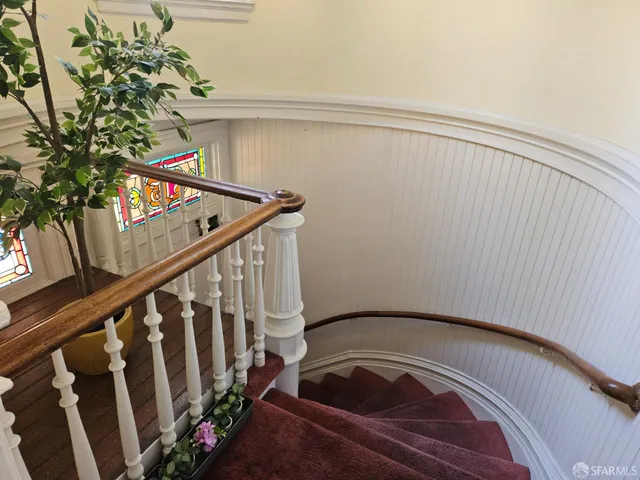 a view of a hallway with stairs