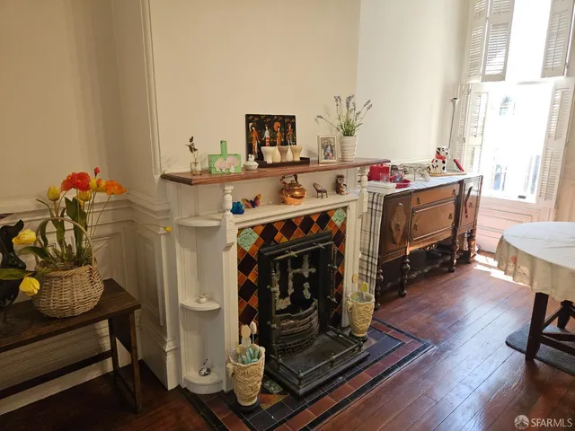 a view of a livingroom with furniture and a fireplace