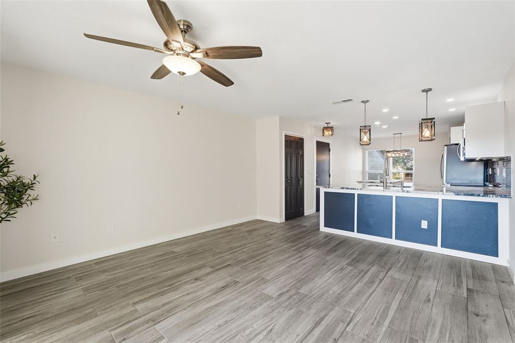 3405 Clark Road, Unit 205 Sarasota, FL 34231 - Photo 15 of 38 a view of kitchen with wooden floor electronic appliances and window