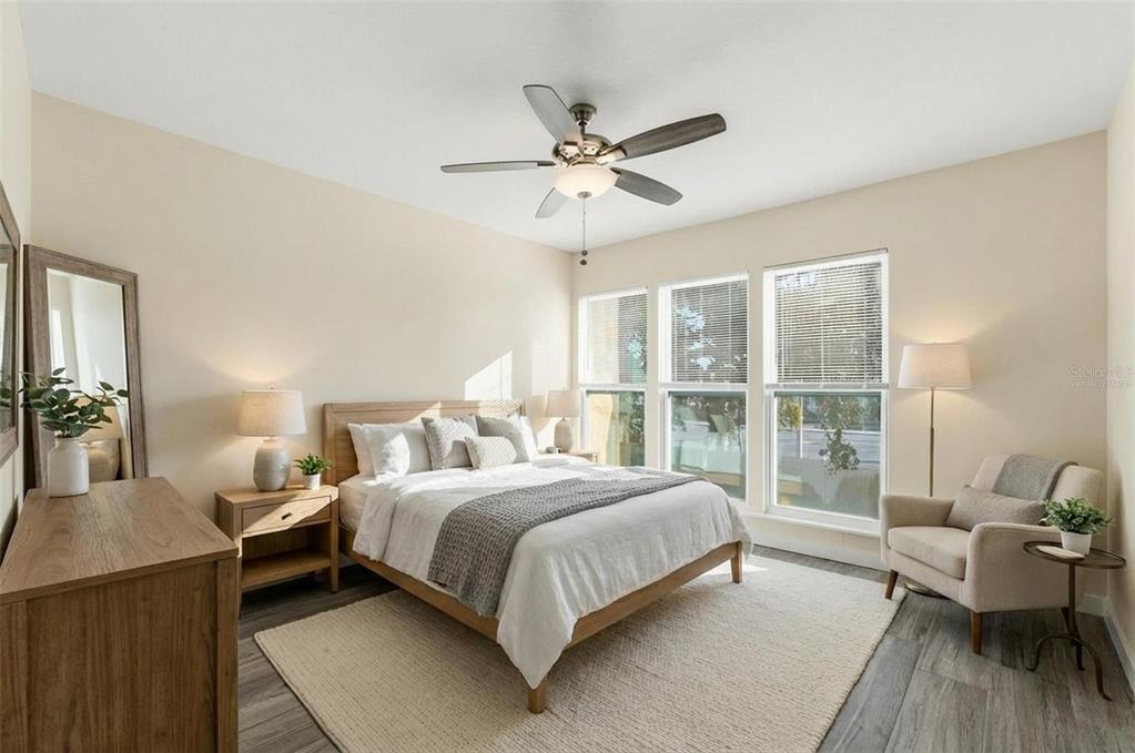 3405 Clark Road, Unit 205 Sarasota, FL 34231 - Photo 16 of 38 a bedroom with a bed and a window