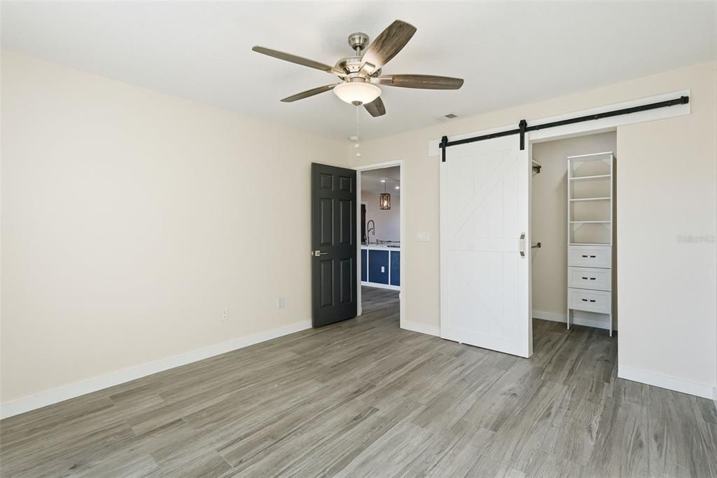 3405 Clark Road, Unit 205 Sarasota, FL 34231 - Photo 18 of 38 a view of an empty room with wooden floor