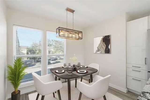 a view of a dining room with furniture window and outside view