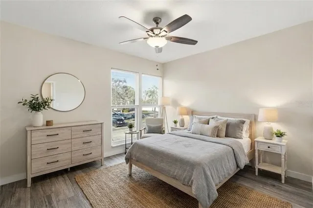 a bedroom with a large bed and a dresser