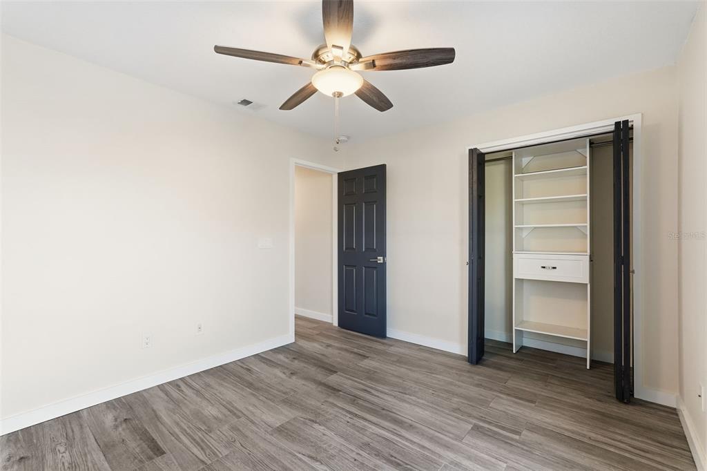 3405 Clark Road, Unit 205 Sarasota, FL 34231 - Photo 26 of 38 a view of an empty room with wooden floor