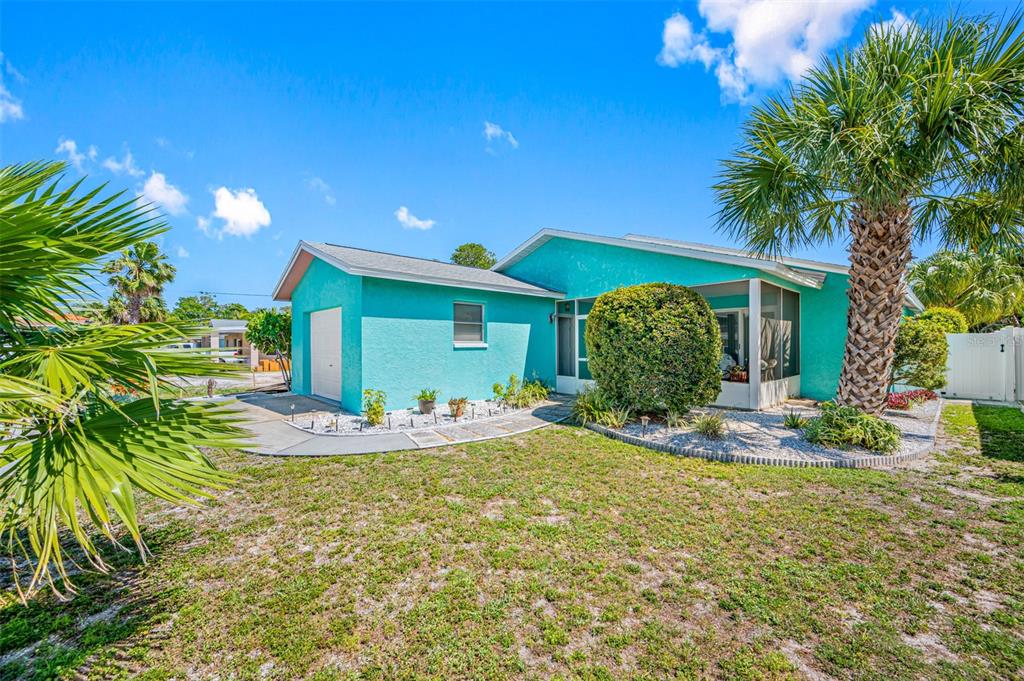119 13th Avenue Indian Rocks Beach, FL 33785 - Photo 5 of 32 a view of a house with backyard and sitting area