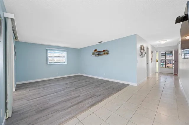 a reading room with furniture and a window