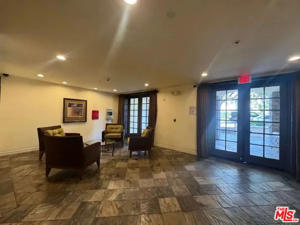 a living room with furniture and window