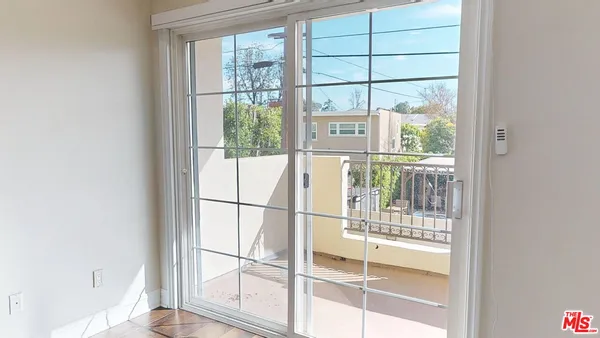 a yellow room with a window