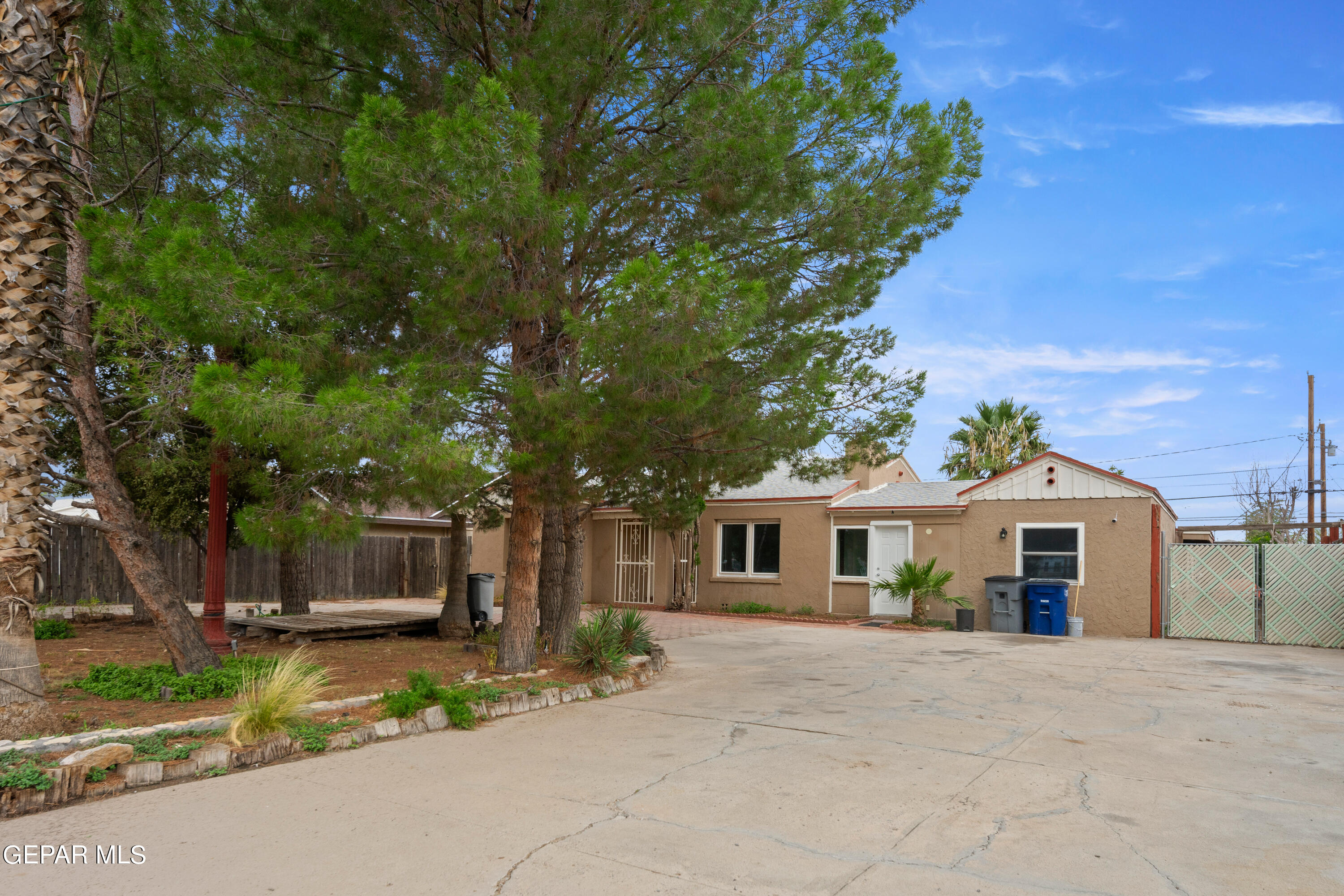 345 Buena Vista Street El Paso, TX 79905 - Photo 1 of 41 a front view of a house with a garden and trees