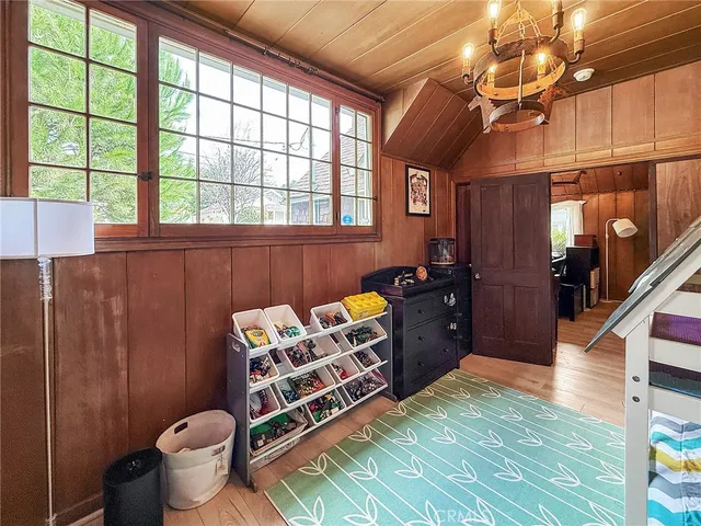a spacious bedroom with a bed and a window