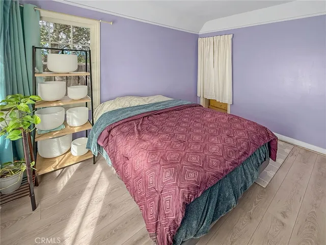 a bedroom with a bed and a table