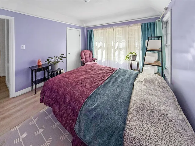 a spacious bedroom with a bed and a table