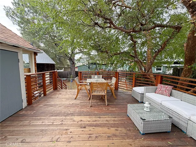 an aerial view of a house with garden space and street view