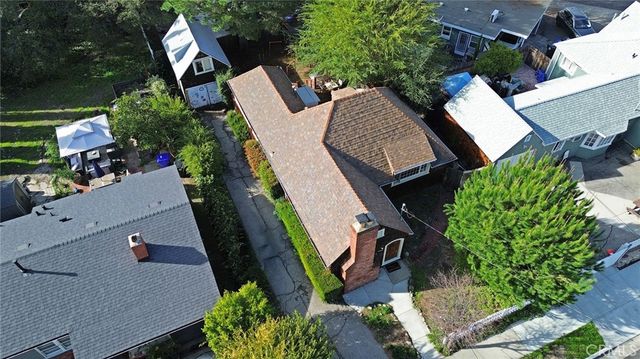 a view of a house with a yard porch and sitting area