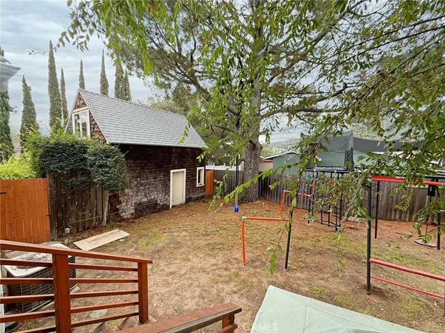 an aerial view of multiple houses with yard