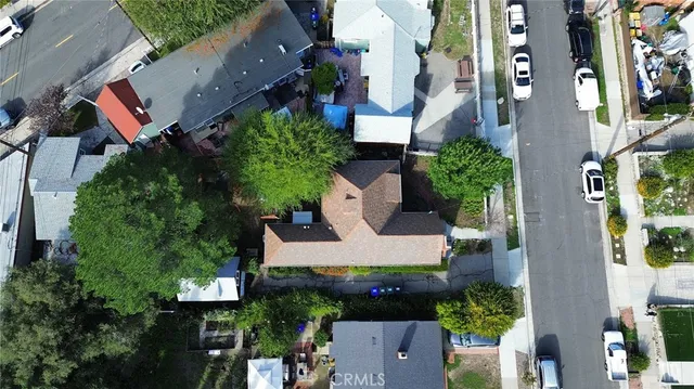 a view of patio with couches and a fire pit and wooden fence