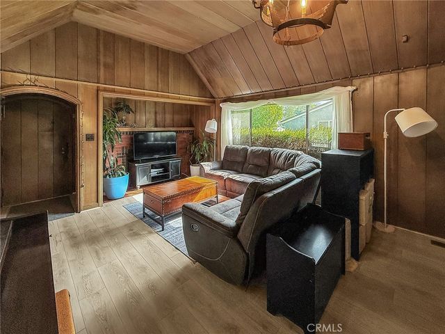 a outdoor living space with furniture and a fireplace