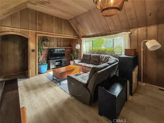 a outdoor living space with furniture and a fireplace