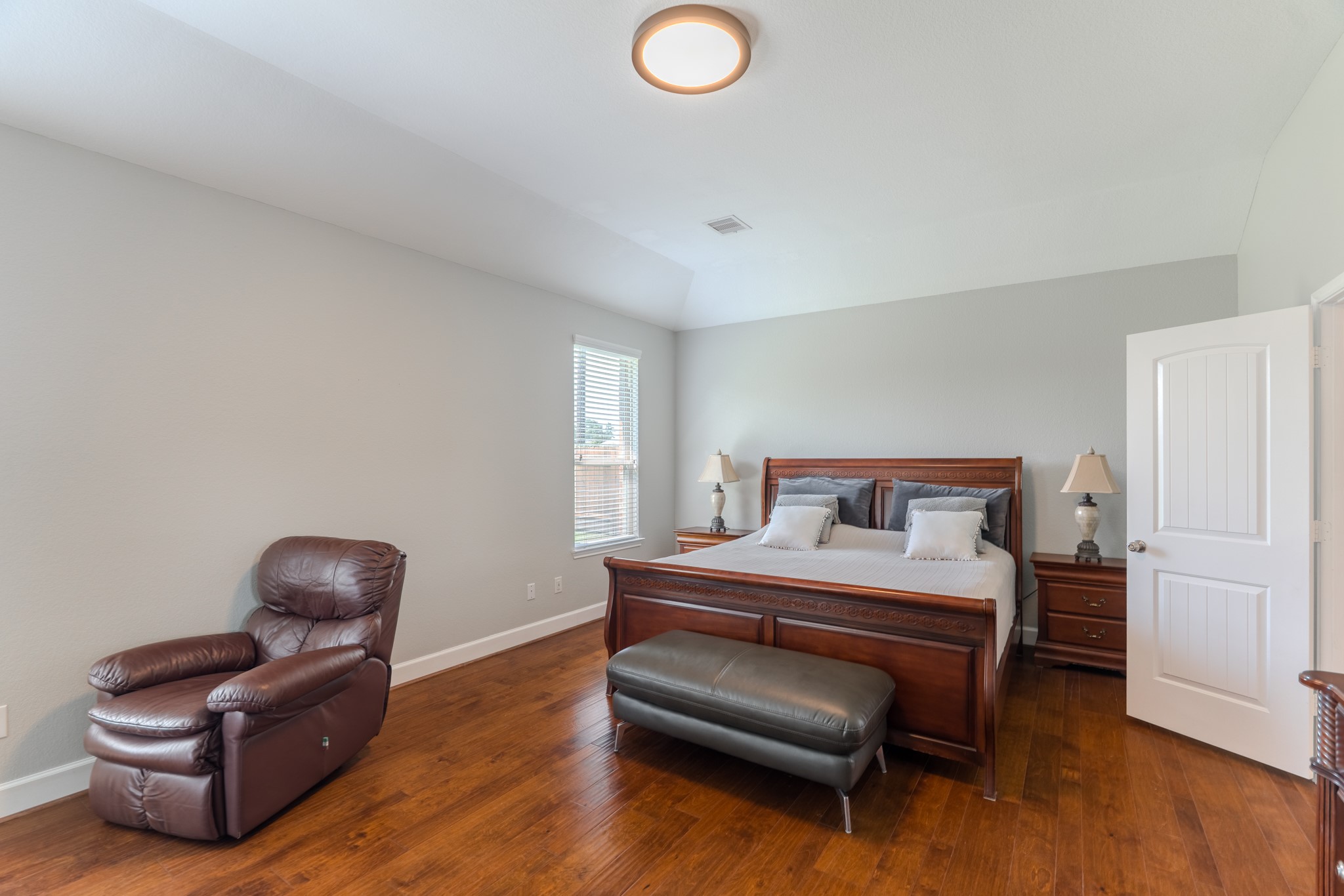 24322 North Newcastle Bay Trail Spring, TX 77389 - Photo 27 of 50 a bedroom with a bed and a chair