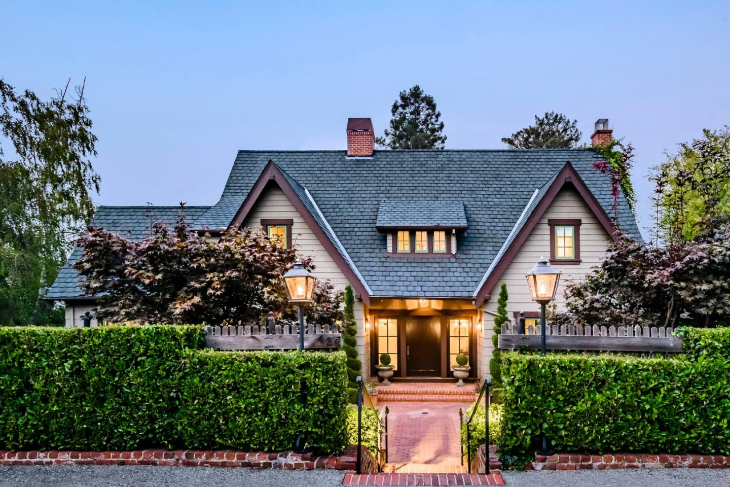a front view of a house with a yard