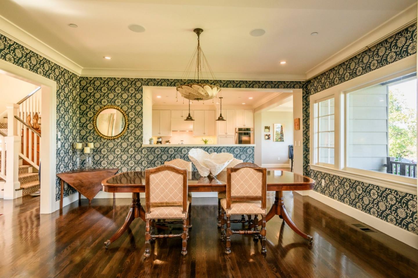 426 El Arroyo Road Hillsborough, CA 94010 - Photo 16 of 50 a view of a dining room with furniture window and wooden floor