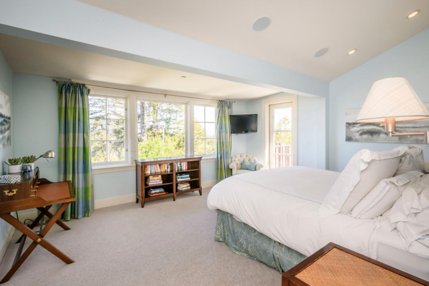 426 El Arroyo Road Hillsborough, CA 94010 - Photo 20 of 50 a bedroom with a bed and a large window