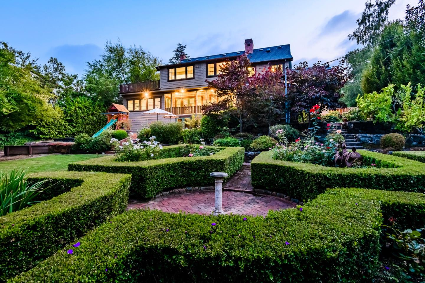 426 El Arroyo Road Hillsborough, CA 94010 - Photo 2 of 50 a view of a garden with a house in the background