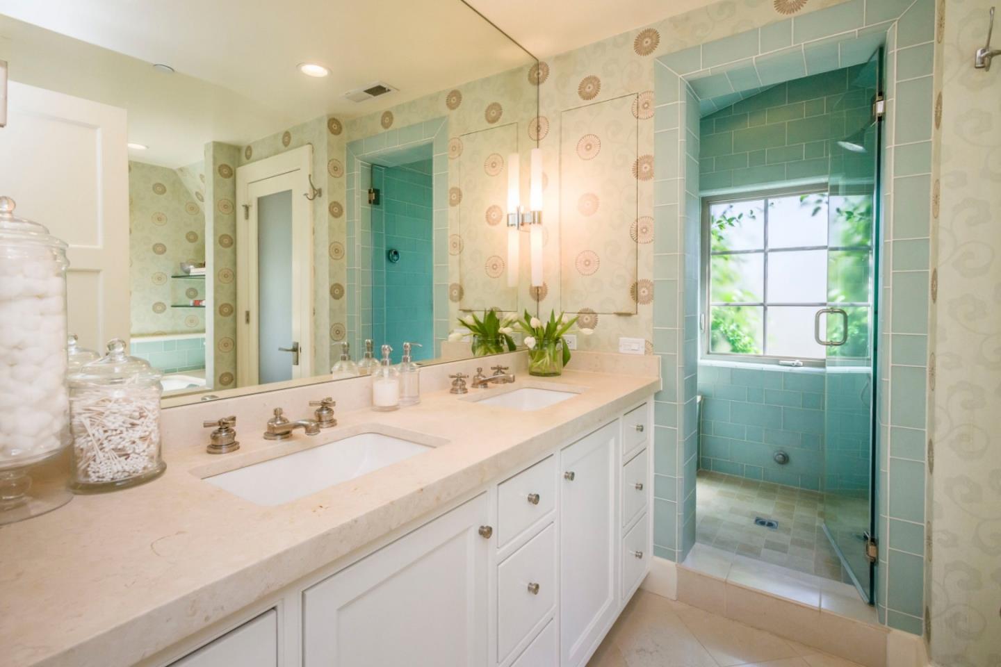 426 El Arroyo Road Hillsborough, CA 94010 - Photo 21 of 50 a bathroom with a double vanity sink mirror and shower