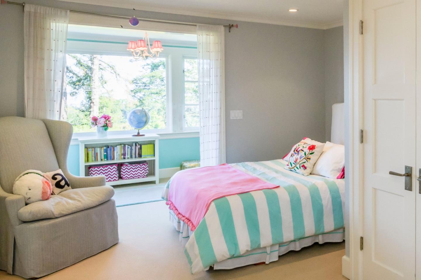 426 El Arroyo Road Hillsborough, CA 94010 - Photo 23 of 50 a bedroom with a bed and a window