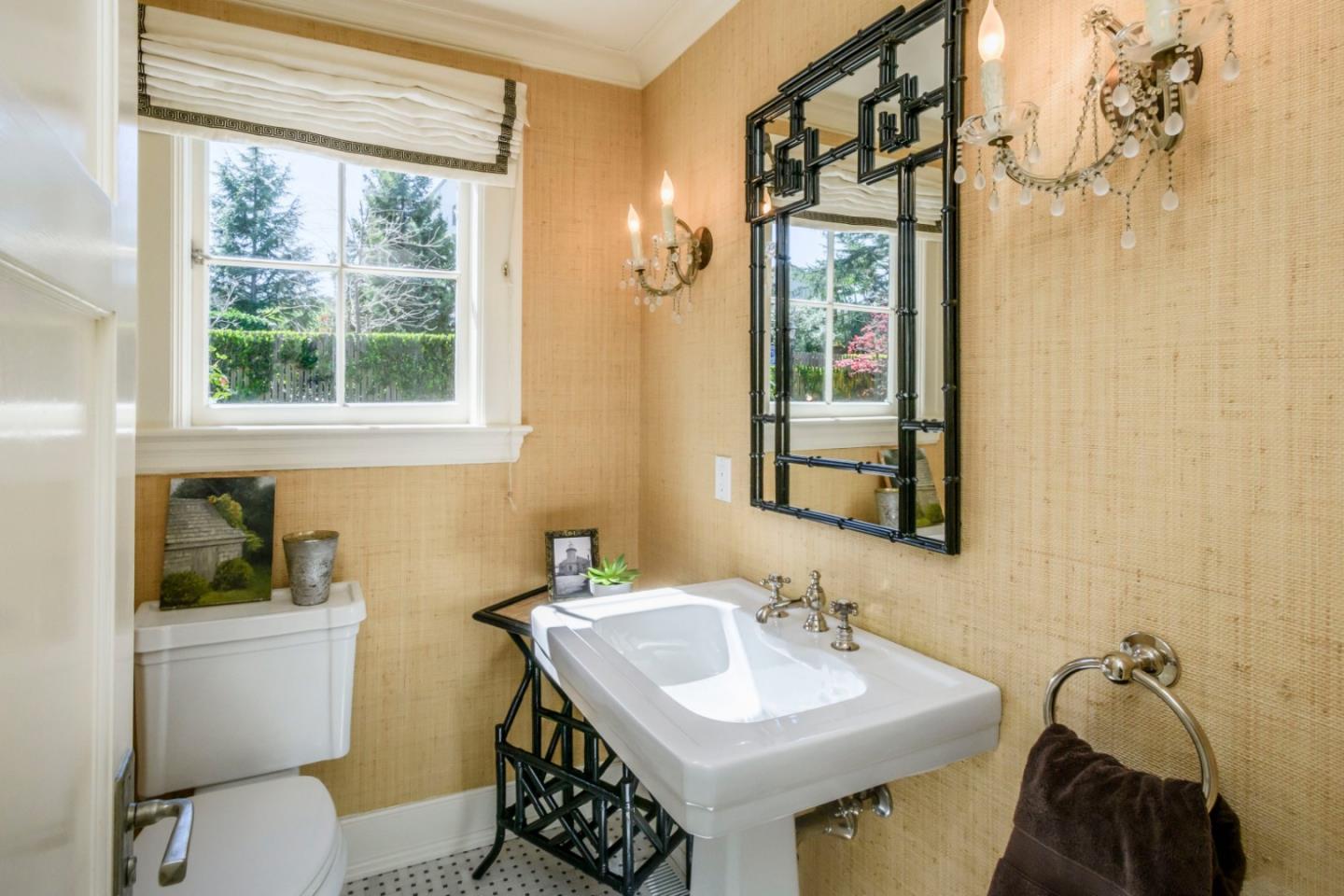426 El Arroyo Road Hillsborough, CA 94010 - Photo 24 of 50 a bathroom with a sink a toilet and a mirror