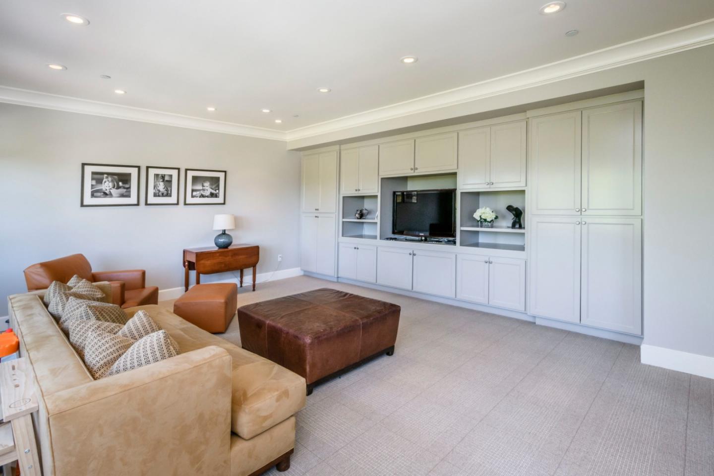 426 El Arroyo Road Hillsborough, CA 94010 - Photo 25 of 50 a living room with furniture and a flat screen tv