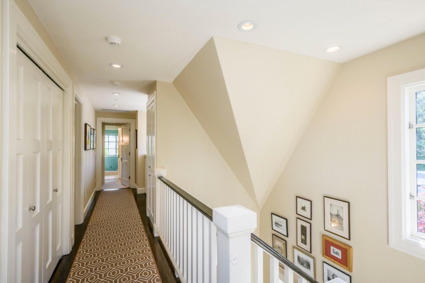 426 El Arroyo Road Hillsborough, CA 94010 - Photo 27 of 50 a view of a hallway with windows