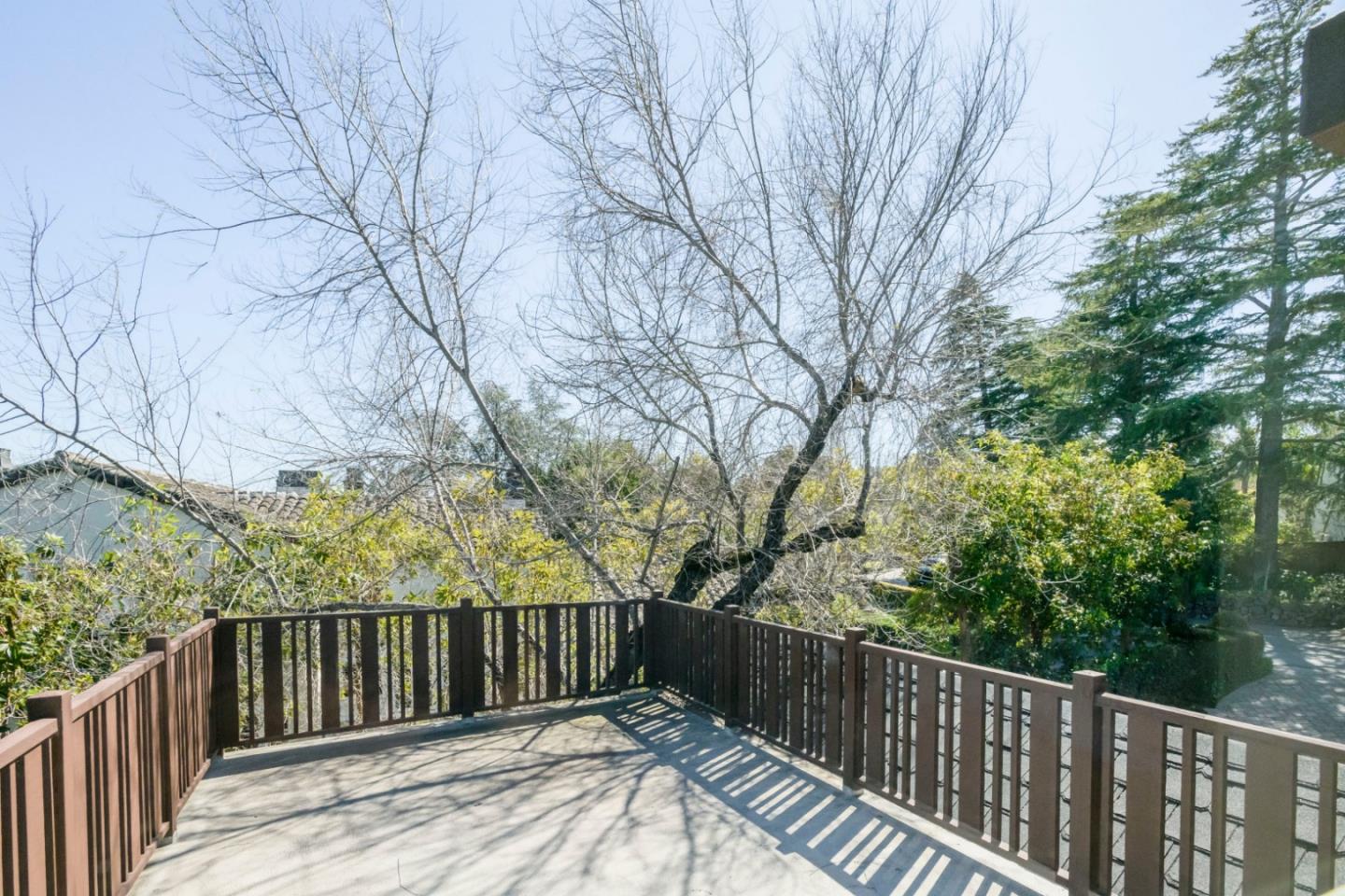 426 El Arroyo Road Hillsborough, CA 94010 - Photo 28 of 50 a view of balcony with wooden floor and fence