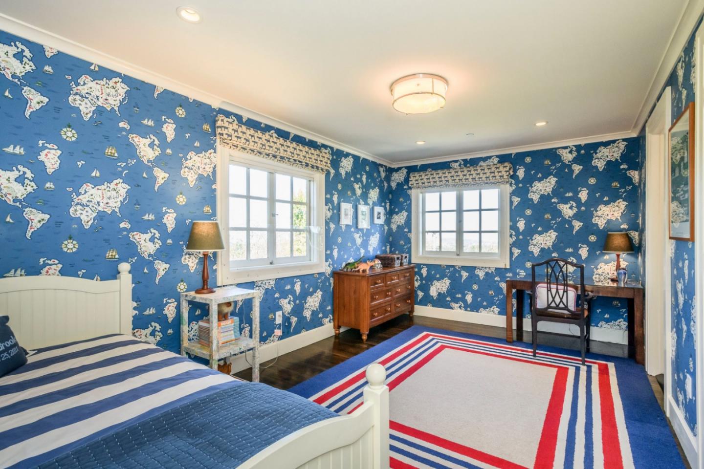 426 El Arroyo Road Hillsborough, CA 94010 - Photo 32 of 50 a bedroom with furniture and a rug