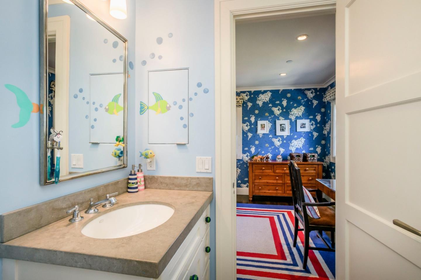 426 El Arroyo Road Hillsborough, CA 94010 - Photo 33 of 50 a bathroom with a sink and a mirror