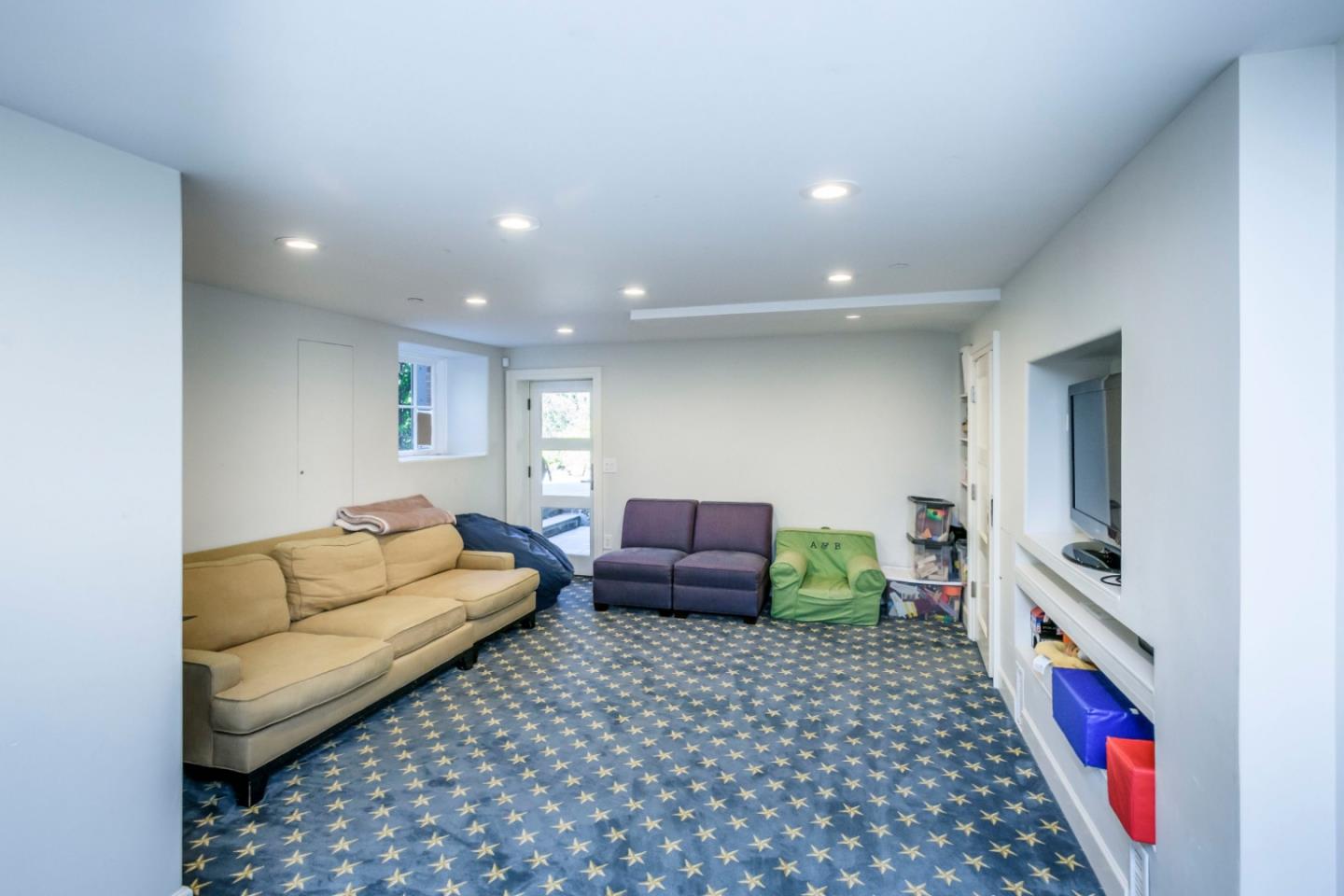 426 El Arroyo Road Hillsborough, CA 94010 - Photo 35 of 50 a living room with furniture and a couch