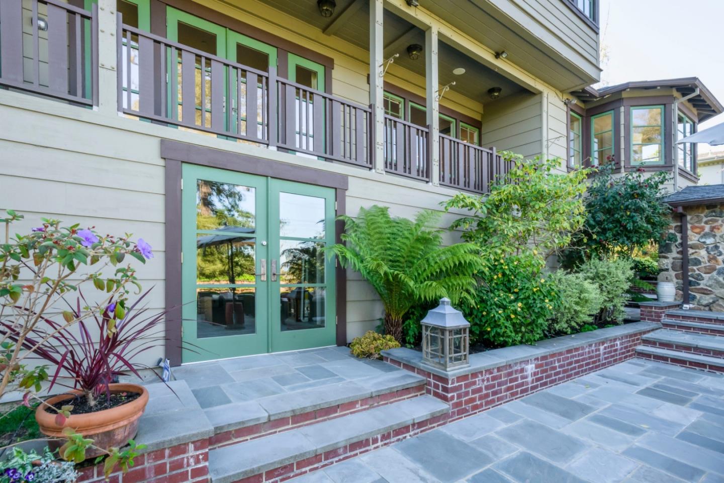 426 El Arroyo Road Hillsborough, CA 94010 - Photo 37 of 50 a view of a building with potted plants