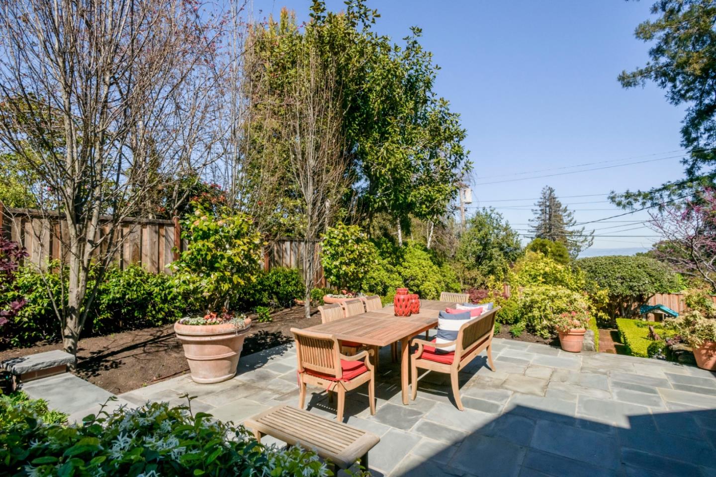 426 El Arroyo Road Hillsborough, CA 94010 - Photo 39 of 50 a backyard of a house with outdoor seating