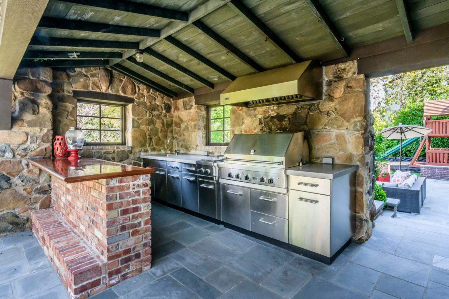 426 El Arroyo Road Hillsborough, CA 94010 - Photo 41 of 50 a kitchen with stove and cabinets