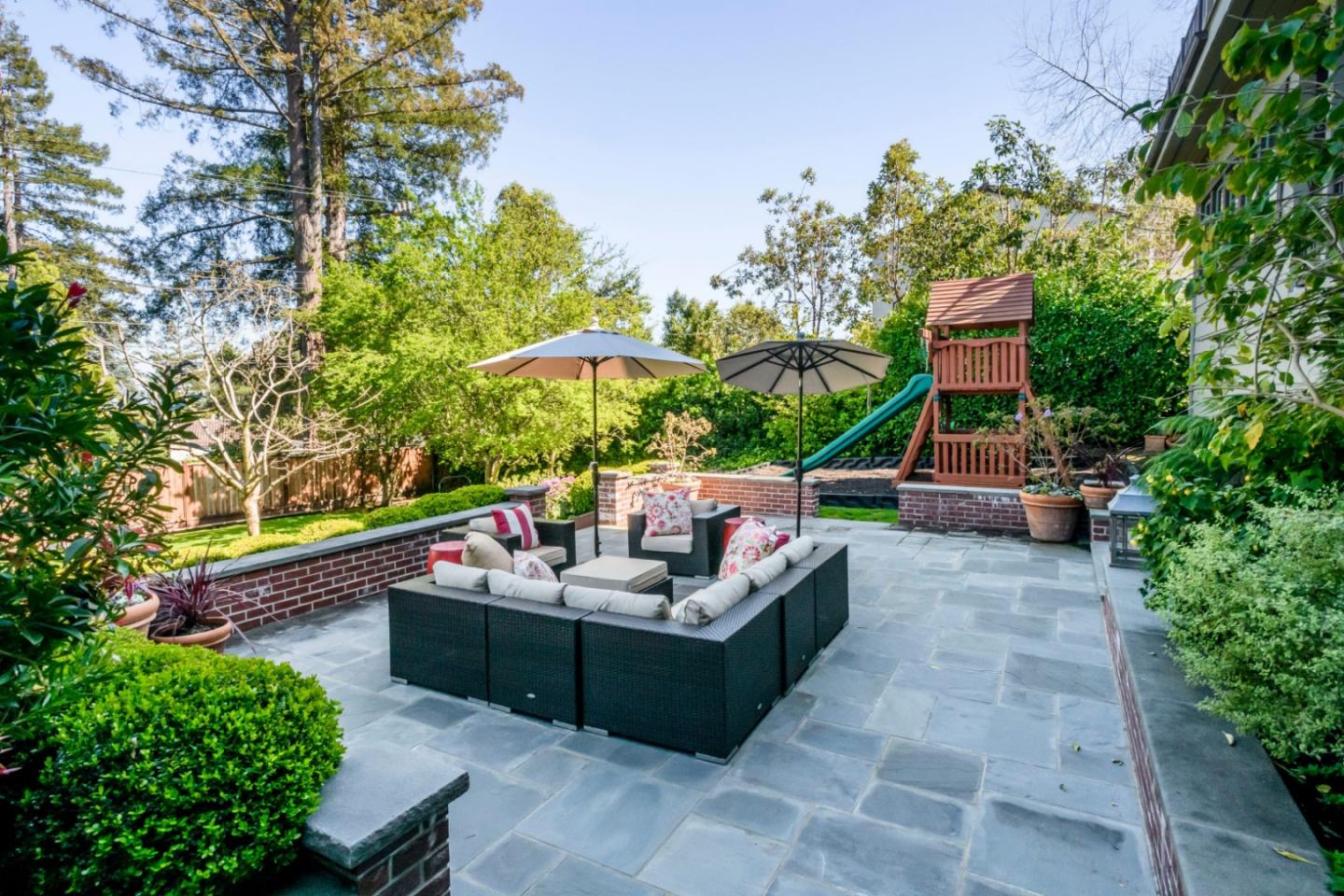 426 El Arroyo Road Hillsborough, CA 94010 - Photo 42 of 50 an outdoor sitting area with furniture and garden view