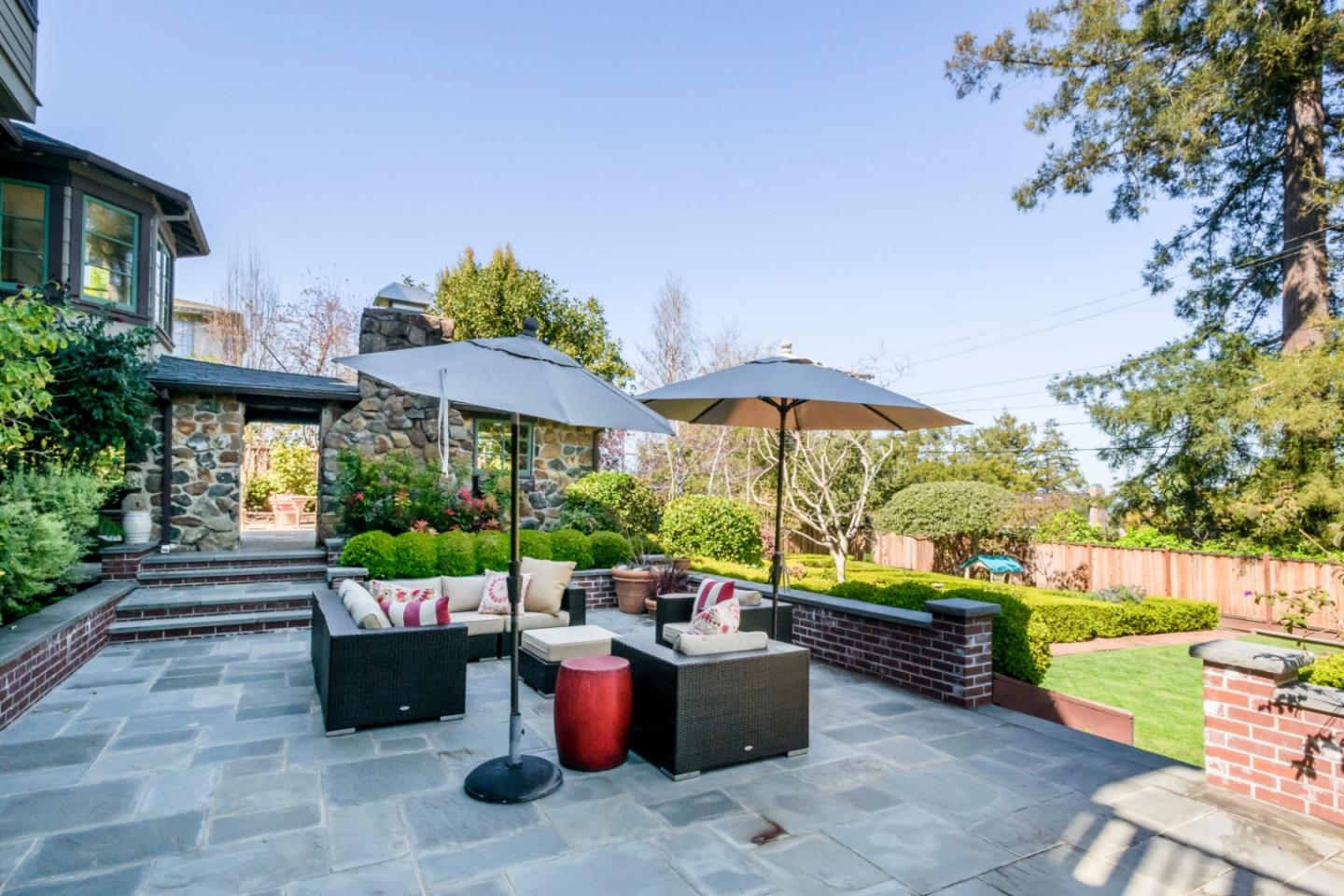426 El Arroyo Road Hillsborough, CA 94010 - Photo 44 of 50 a view of a backyard with sitting area and furniture