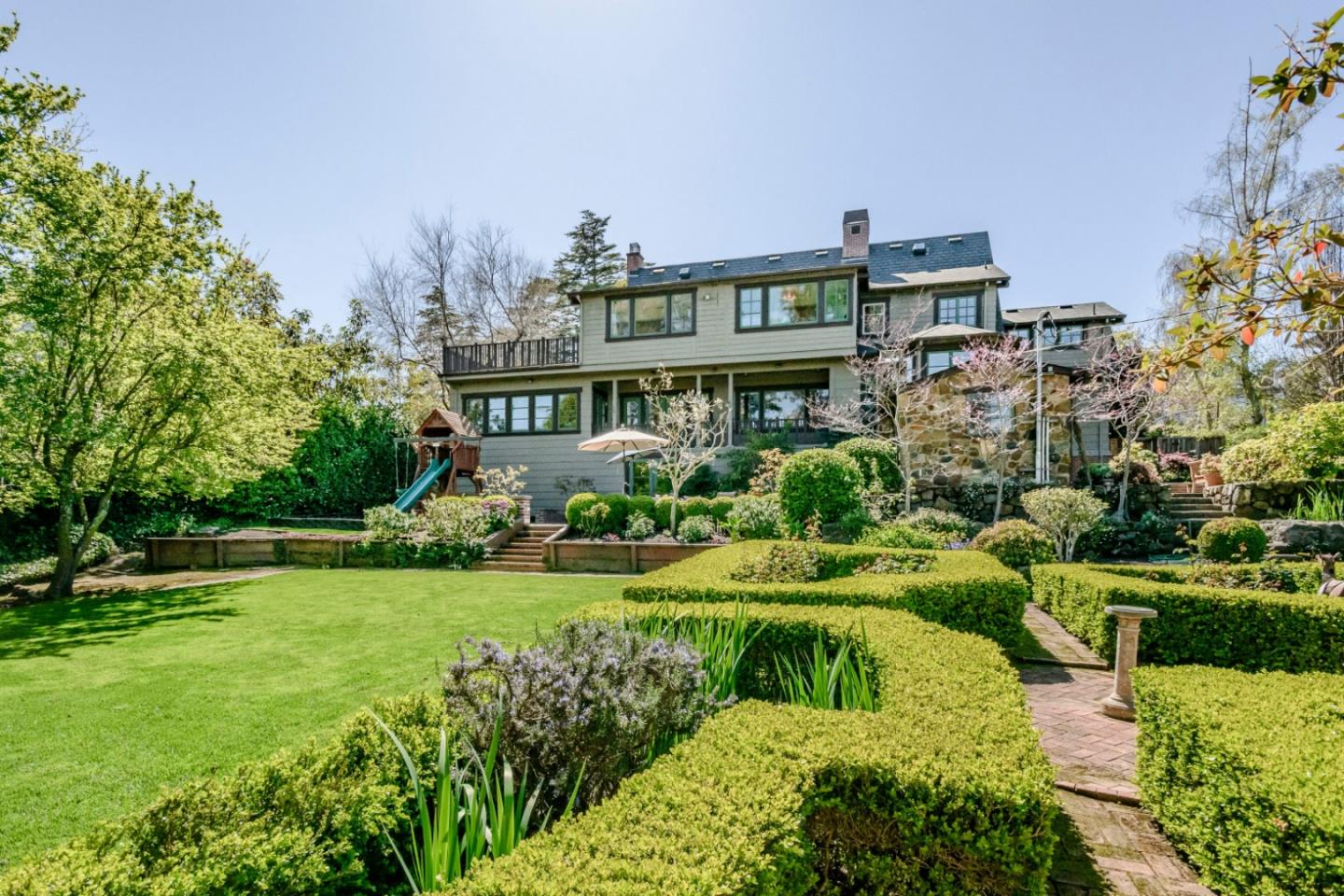 426 El Arroyo Road Hillsborough, CA 94010 - Photo 46 of 50 a front view of a house with garden