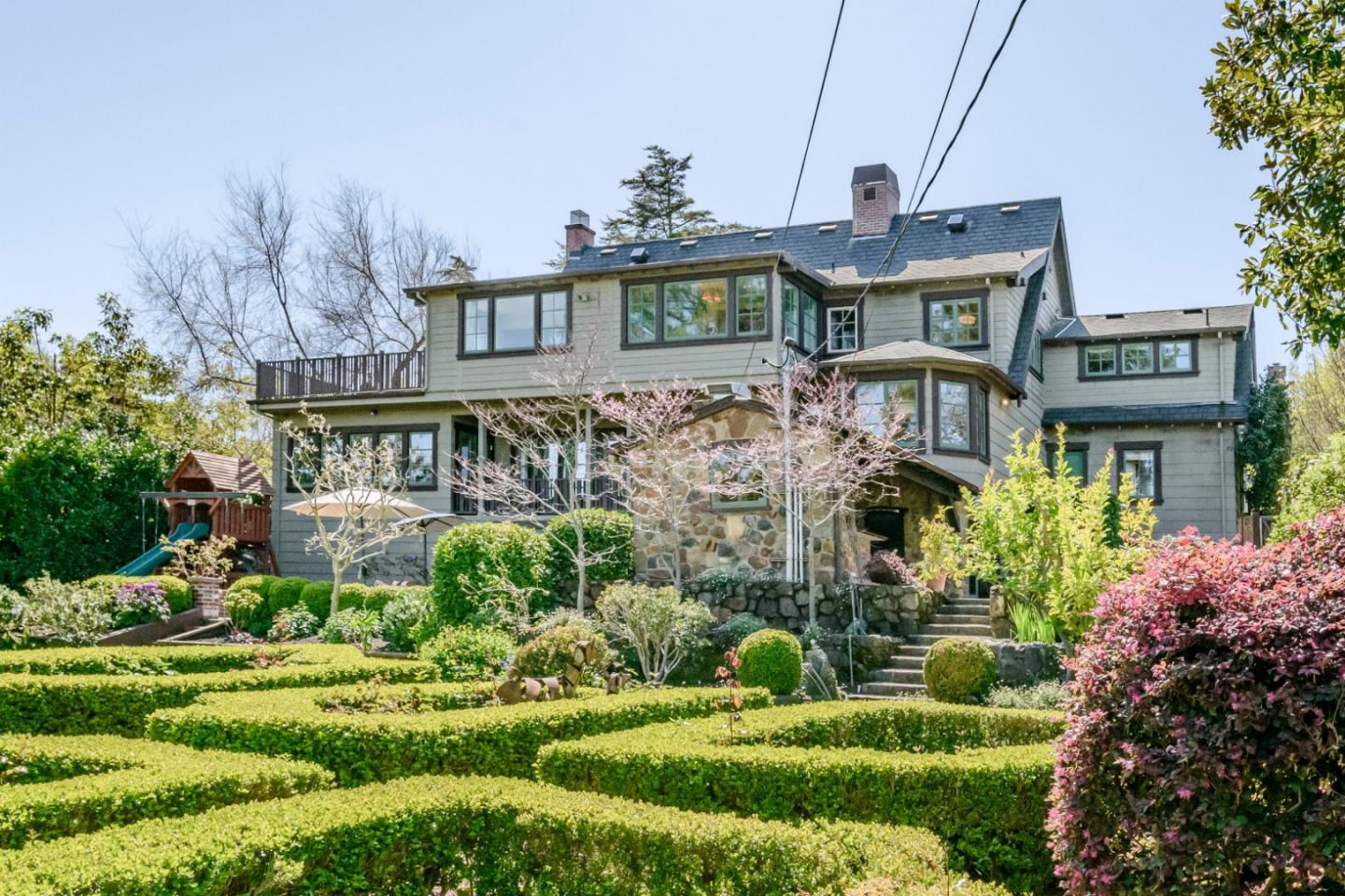 426 El Arroyo Road Hillsborough, CA 94010 - Photo 47 of 50 a front view of a house with a garden