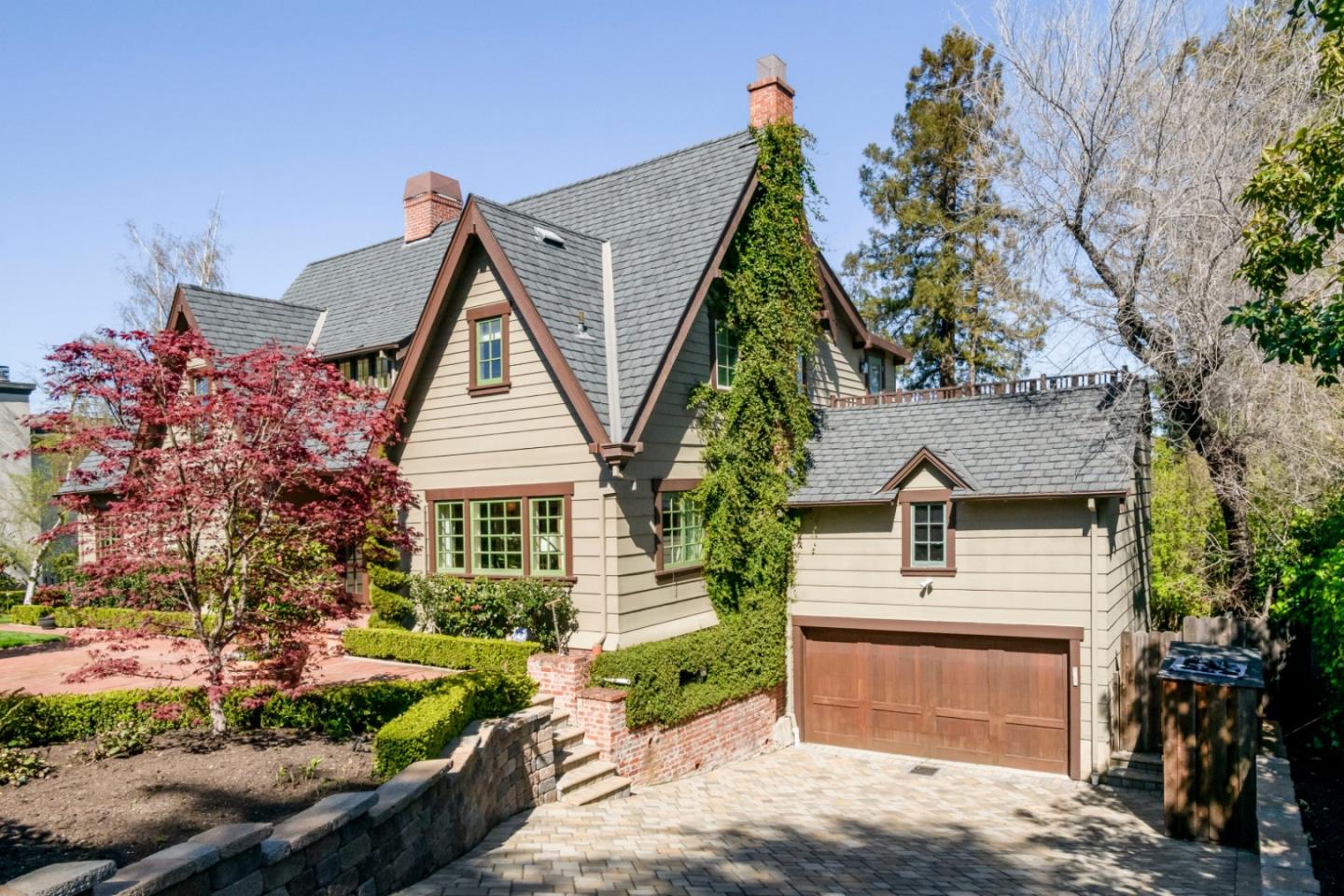 426 El Arroyo Road Hillsborough, CA 94010 - Photo 6 of 50 a front view of a house with garden