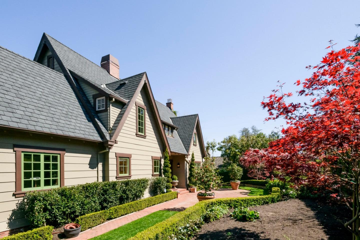 426 El Arroyo Road Hillsborough, CA 94010 - Photo 7 of 50 a front view of a house with a yard