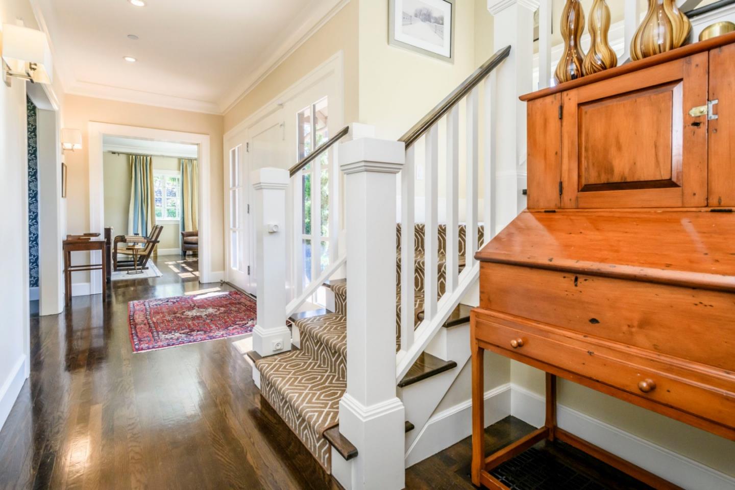 426 El Arroyo Road Hillsborough, CA 94010 - Photo 8 of 50 a balcony with wooden floor and furniture