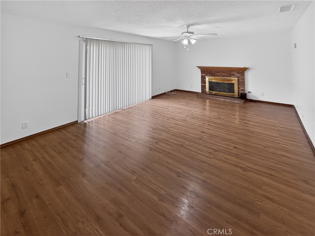 7451 Diamond Street Riverside, CA 92504 - Photo 10 of 31 wooden floor in an empty room with a window